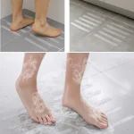 Non-slip safety strips protecting wet bathroom floor tiles